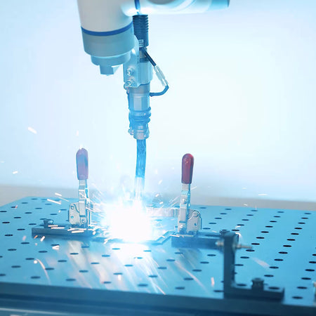 Dobot CR10A cobot welding a steel part on the mobile welding platform